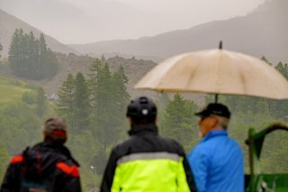 epa12140959 People look at an avalanche from the Birch glacier near Blatten, Switzerland, Wednesday, May 28, 2025. The Birch Glacier has caused avalanches of ice, snow, water and rocks, as the leading edge collapses. EPA/JEAN-CHRISTOPHE BOTT