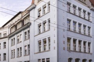 Le bâtiment Unitobler dans le quartier de Länggasse à Berne. Toute personne souhaitant étudier à Berne devra à l’avenir payer des frais d’inscription plus élevés. (archives) KEYSTONE/CHRISTIAN BEUTLER