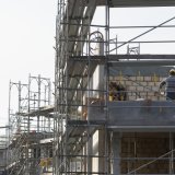 La nouvelle Convention nationale (CN) permet d'éviter un vide conventionnel dans la branche de la construction et donc un dumping salarial (archives). KEYSTONE/GAETAN BALLY